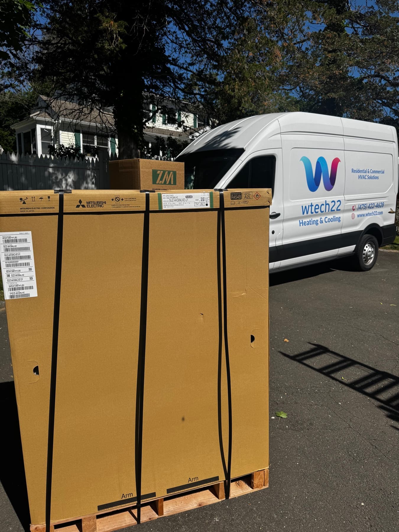wtech22 Heating and Cooling cargo van delivering Mitsubishi heat pump equipment for a Greenwich Connecticut installation